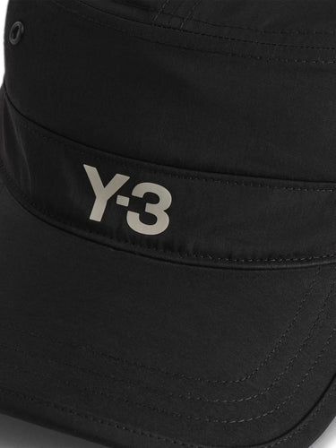 Close-up packshot of the front of the Y-3 Workwear Cap in Black, showing the contrasted silicone Y-3 logo and curved brim.