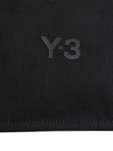 Close-up of the front of the Y-3 X-Body Pouch in Black, highlighting the subtle Y-3 logo and CORDURA® fabric texture.