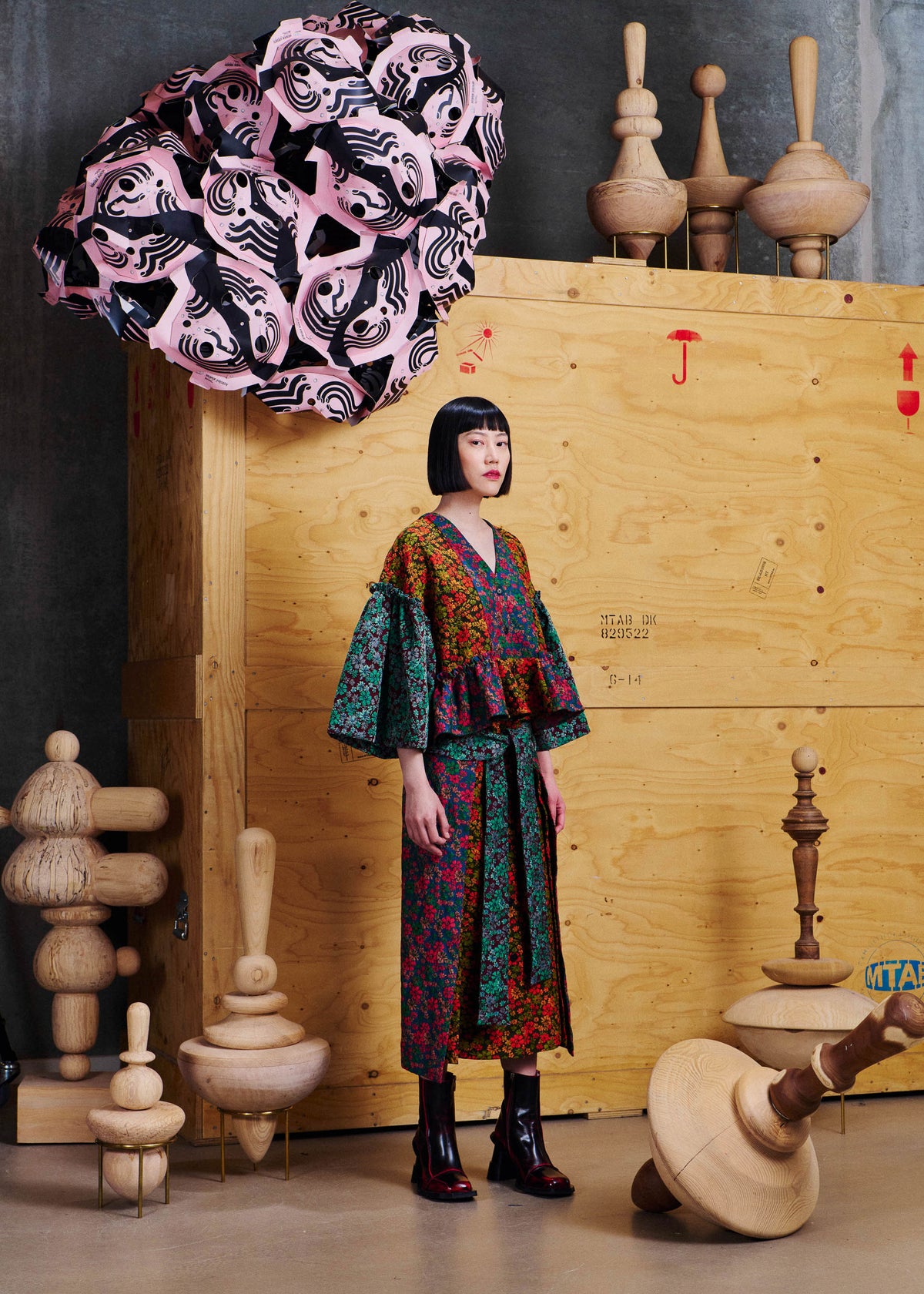 Henrik Vibskov Leek Skirt in Floral Affairs worn side view, showing the wrap-style front panel, side slit detail and layered floral construction.