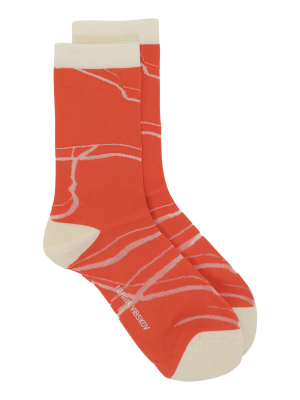 Henrik Vibskov Water Reflection socks for women in red and cream - 1