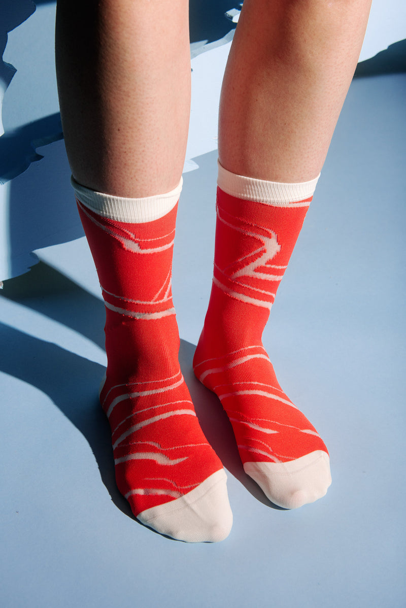 Henrik Vibskov Water Reflection socks for women in red and cream - 2